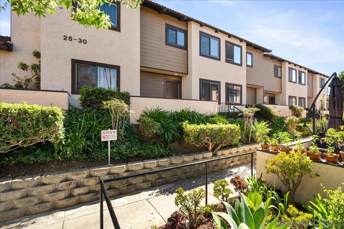 955 Postal Way, Unit 29 Vista, CA 92083 - Photo 19 of 32 a front view of a house with a yard and garden