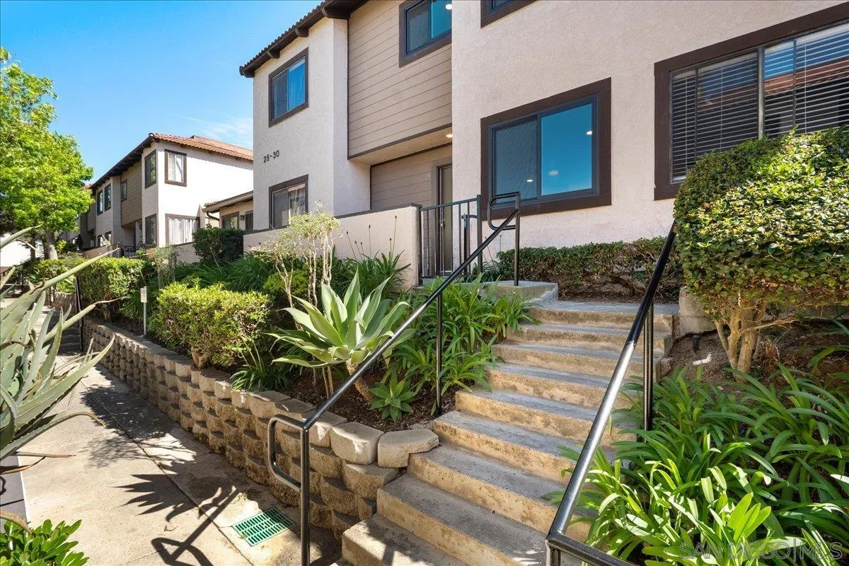 955 Postal Way, Unit 29 Vista, CA 92083 - Photo 21 of 32 a front view of a house with a yard