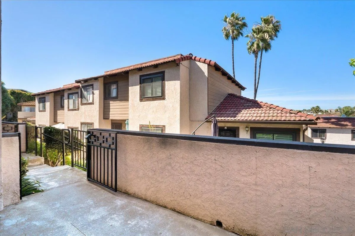 955 Postal Way, Unit 29 Vista, CA 92083 - Photo 22 of 32 a house view with a garden space