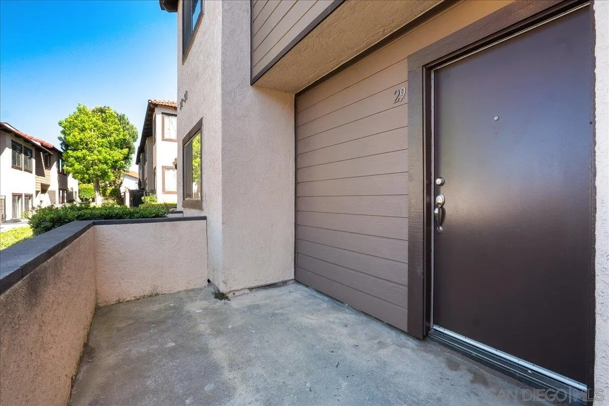 955 Postal Way, Unit 29 Vista, CA 92083 - Photo 23 of 32 a view of a house with a yard
