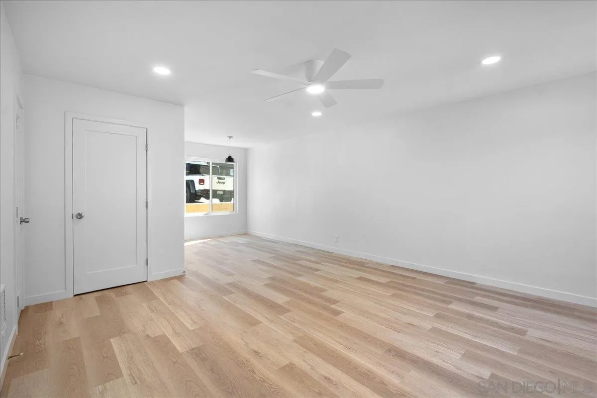 955 Postal Way, Unit 29 Vista, CA 92083 - Photo 6 of 32 wooden floor in an empty room with a window