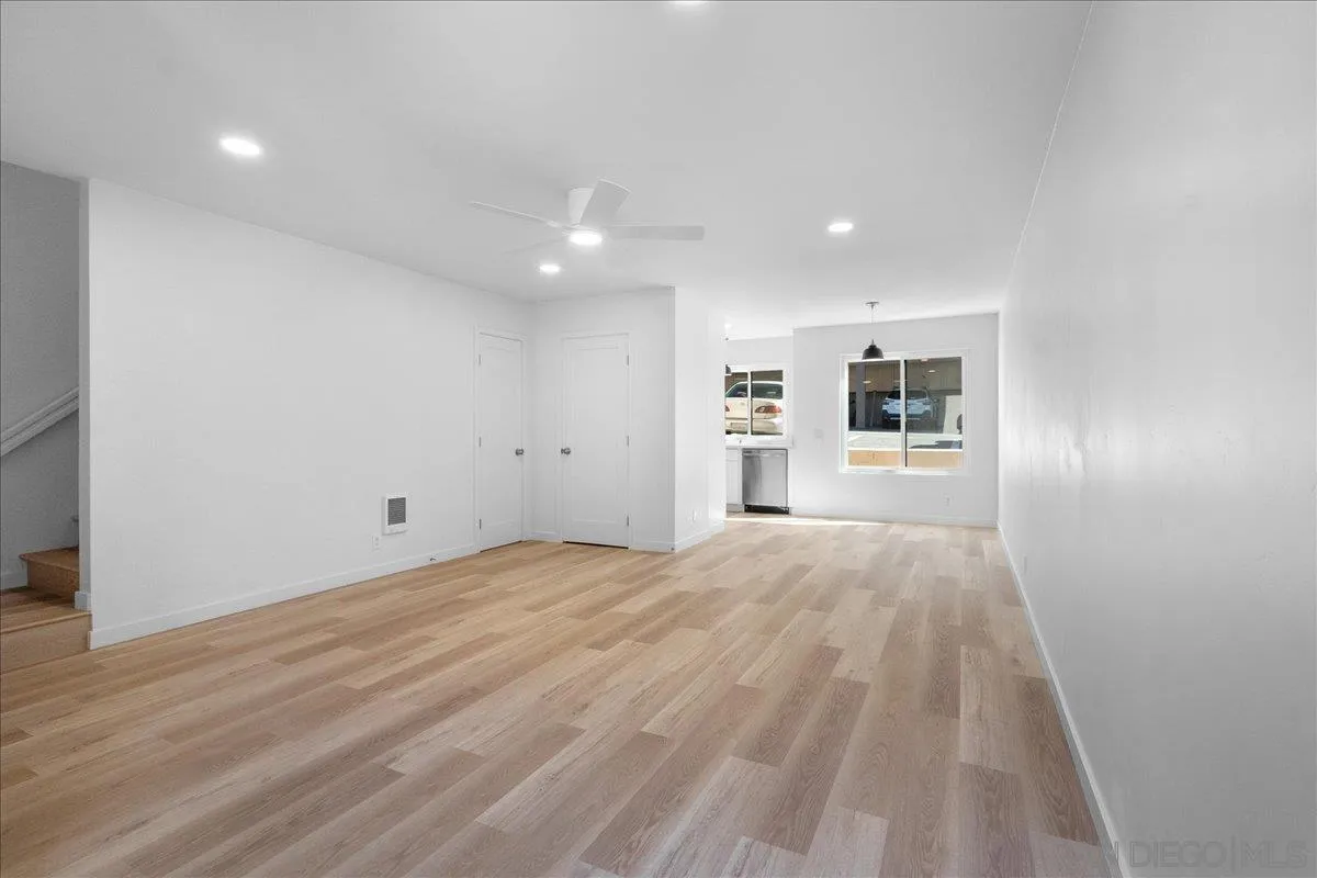 955 Postal Way, Unit 29 Vista, CA 92083 - Photo 7 of 32 a view of empty room with wooden floor