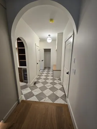 a view of a kitchen with a sink and a microwave