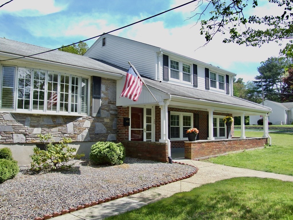 30 Donnell Road Walpole, MA 02032 - Photo 1 of 32 a front view of a house with a yard and potted plants