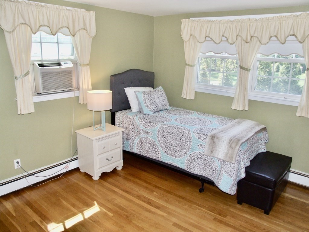 30 Donnell Road Walpole, MA 02032 - Photo 11 of 32 a bedroom with a bed chair and a large window