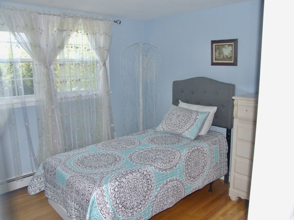 30 Donnell Road Walpole, MA 02032 - Photo 12 of 32 a bedroom with a bed and a window
