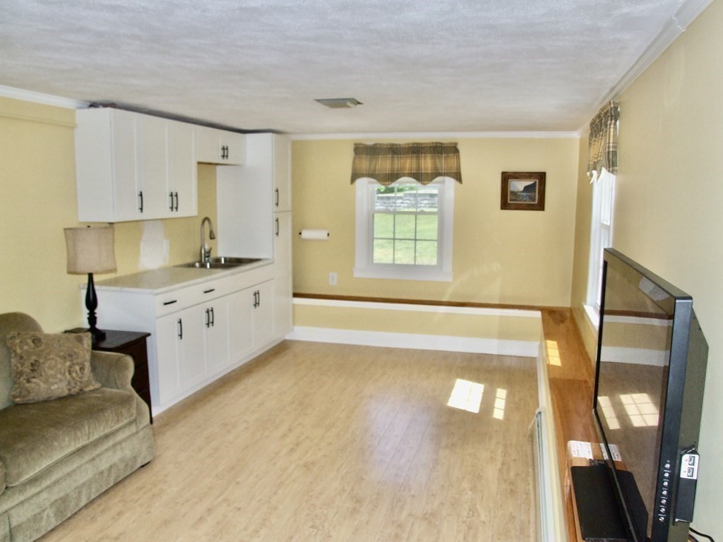 30 Donnell Road Walpole, MA 02032 - Photo 19 of 32 a view of a kitchen with furniture and a window