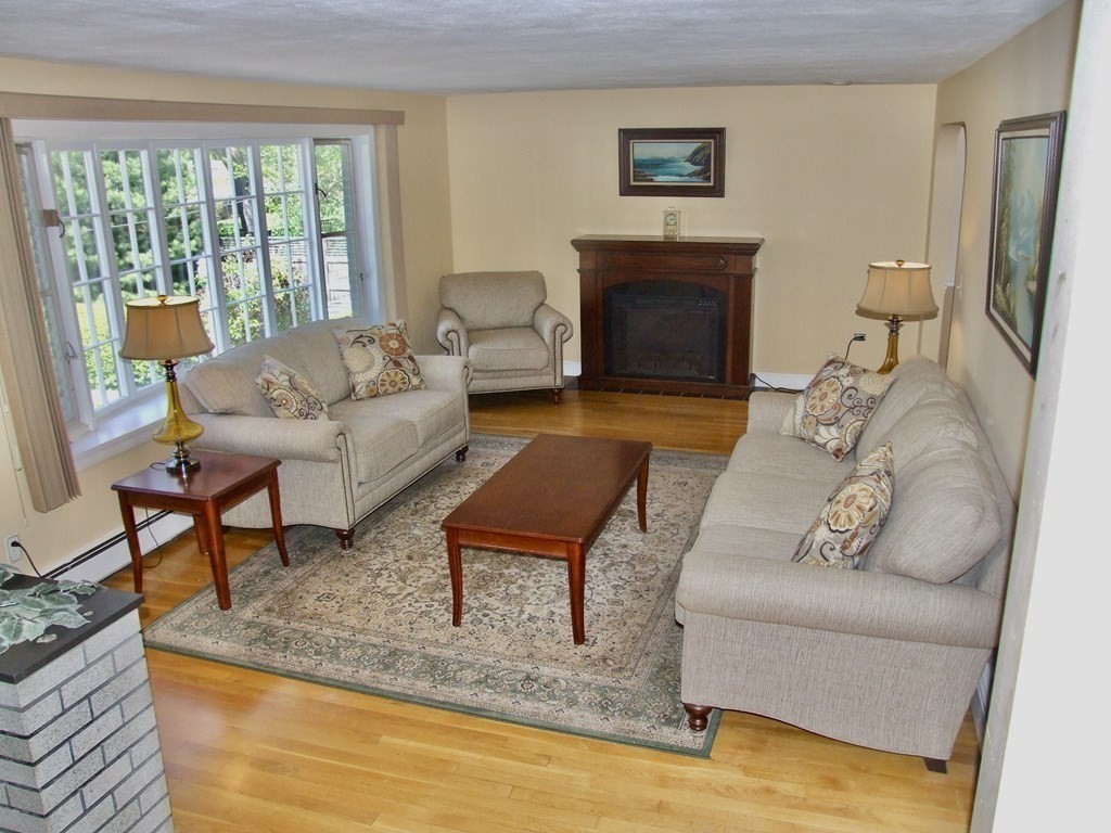 30 Donnell Road Walpole, MA 02032 - Photo 3 of 32 a living room with furniture and a fireplace