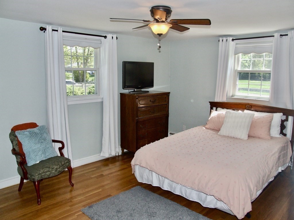 30 Donnell Road Walpole, MA 02032 - Photo 9 of 32 a bedroom with a bed and a television