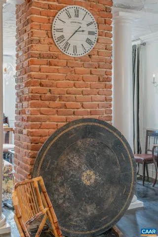 a living room with furniture a table and a chandelier