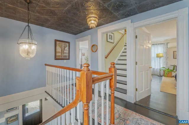 a balcony with furniture and wooden floor
