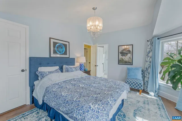 a view of a house with a chairs and table under an umbrella