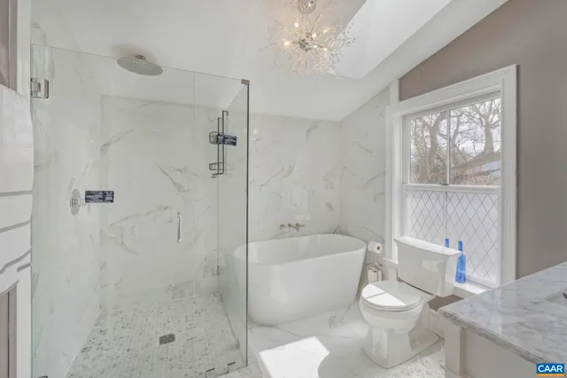 an aerial view of multiple houses with a yard