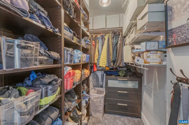 a bathroom with a glass shower door and mirror