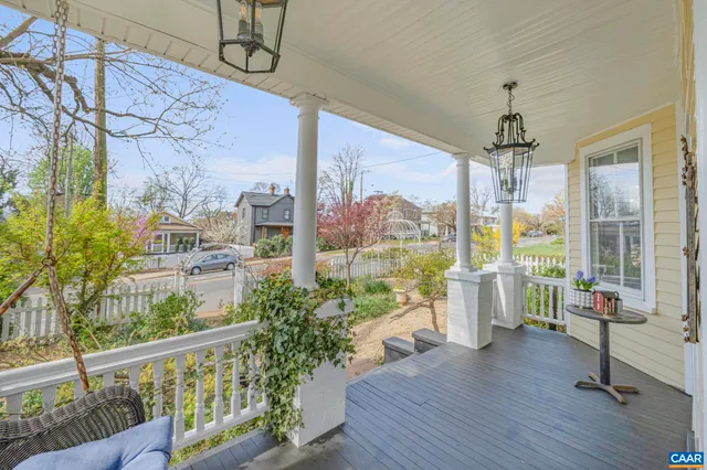 a view of entryway with furniture and wooden floor