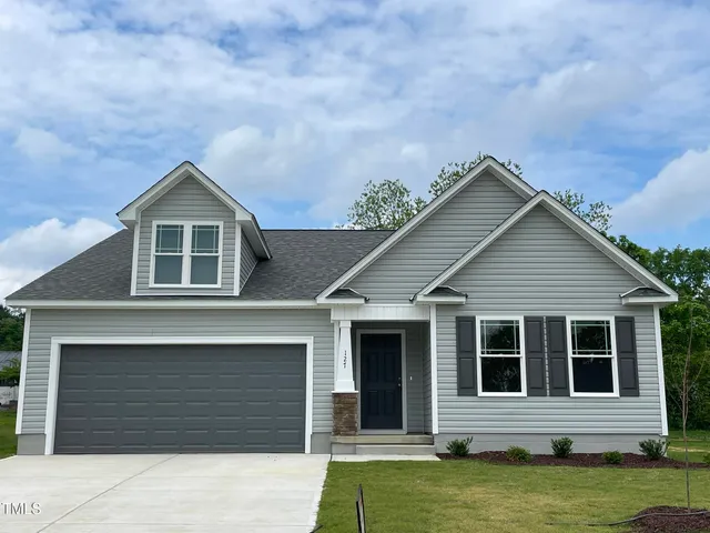 a house view with a garden space