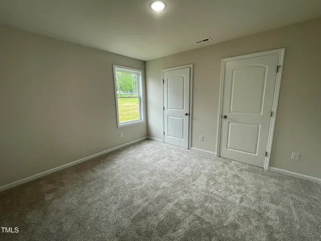a view of an empty room and window