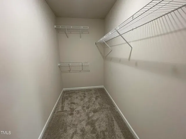 a view of a room with racks on the wall