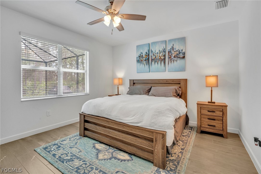 17388 Walnut Run Drive Alva, FL 33920 - Photo 17 of 24 a bedroom with a bed dresser and a window