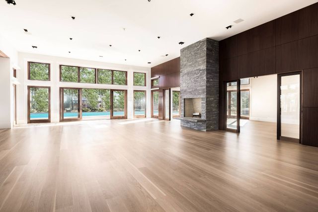 a view of an entryway with wooden floor