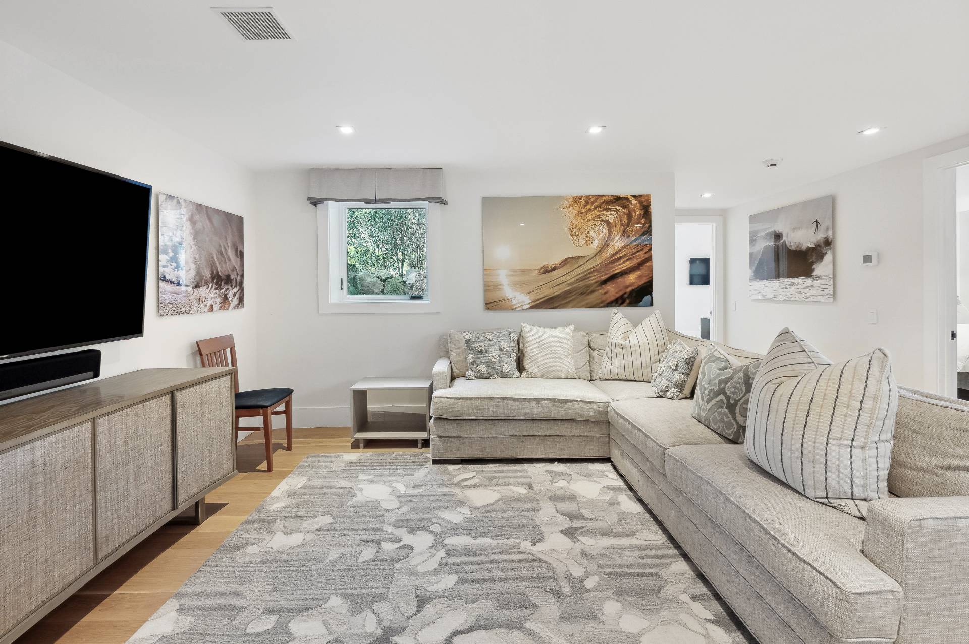 26 Mashomuck Drive Sag Harbor, NY 11963 - Photo 17 of 25 a living room with furniture and a flat screen tv