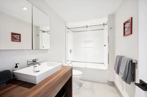 a bathroom with a sink a toilet and a bathtub