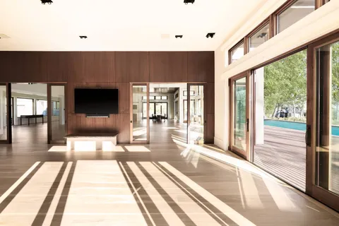a lobby with furniture and floor to ceiling window