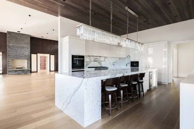 a large kitchen with lots of counter space and stainless steel appliances
