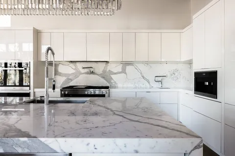 a kitchen with a sink and cabinets