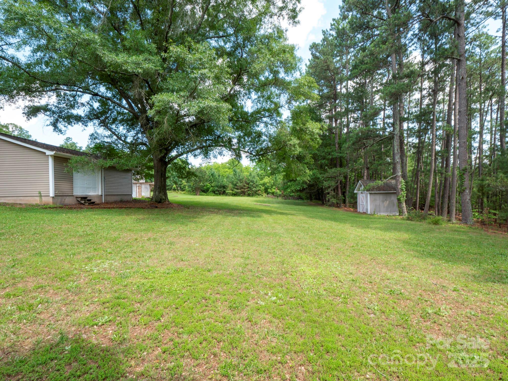 409 State Rd S-46-27 Clover, SC 29710 - Photo 4 of 43 a view of a house with a backyard
