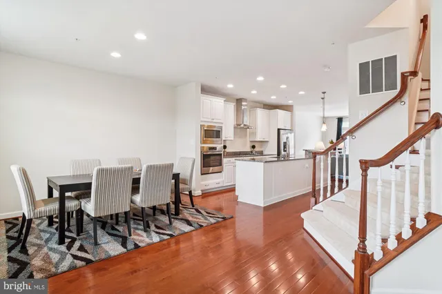a dining room with furniture and entryway