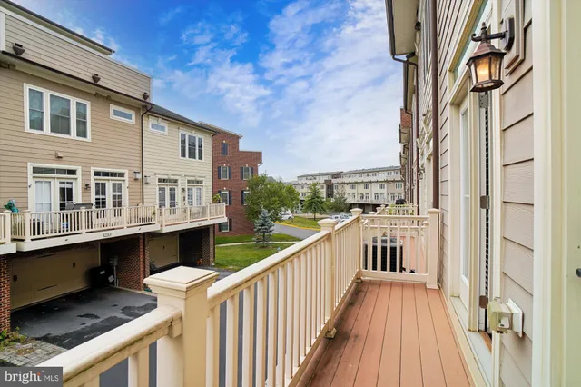 a balcony with view of nearby houses