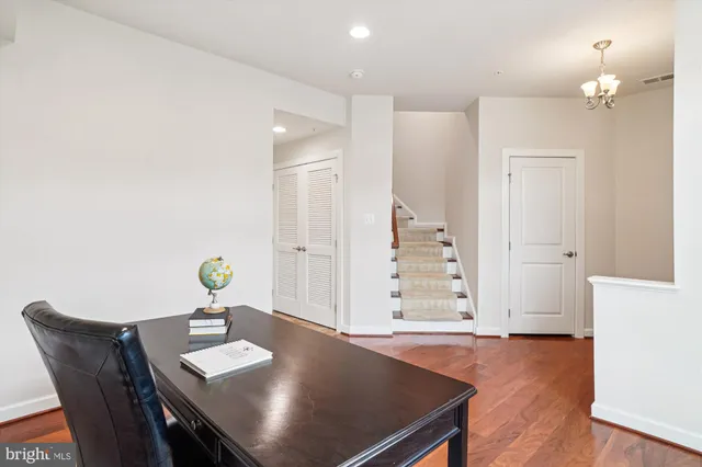 a view of kitchen island dining room cabinets and wooden floor