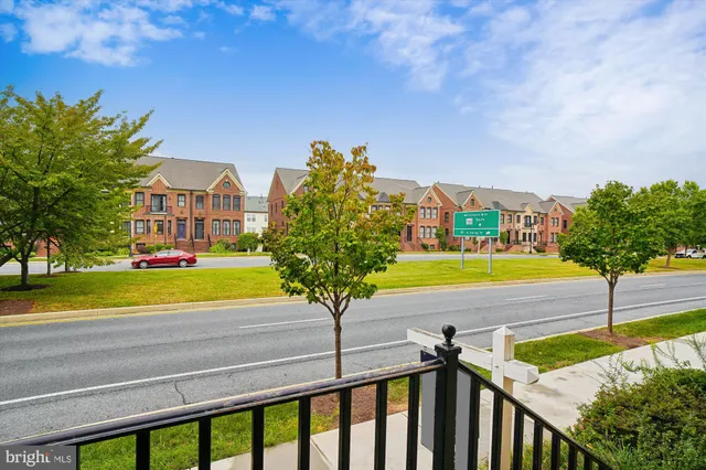 a view of yard with swimming pool and seating area