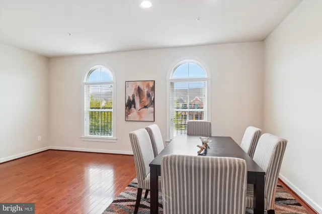 a view of a dining room with furniture and a window