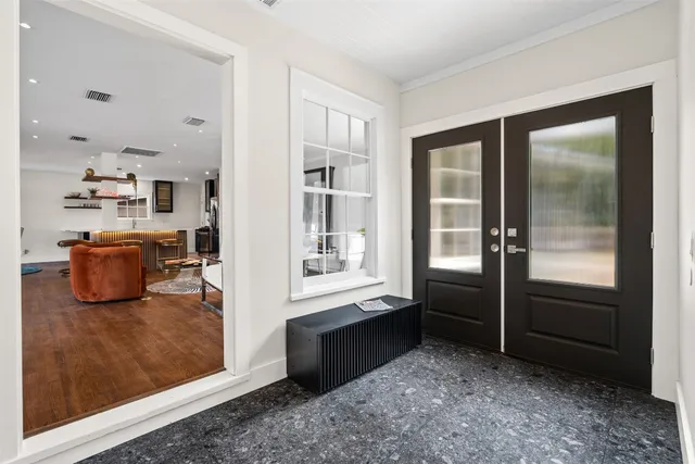 a bedroom with a bed and a lamp