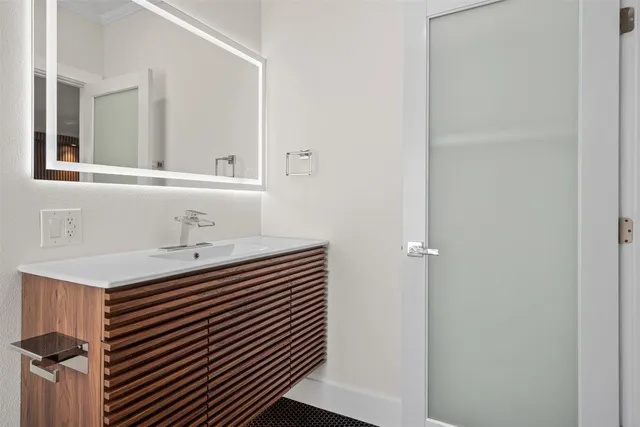 a balcony with table and chairs