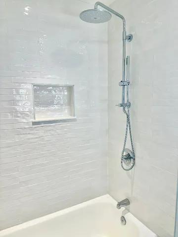 a bathroom with a shower and a bathtub