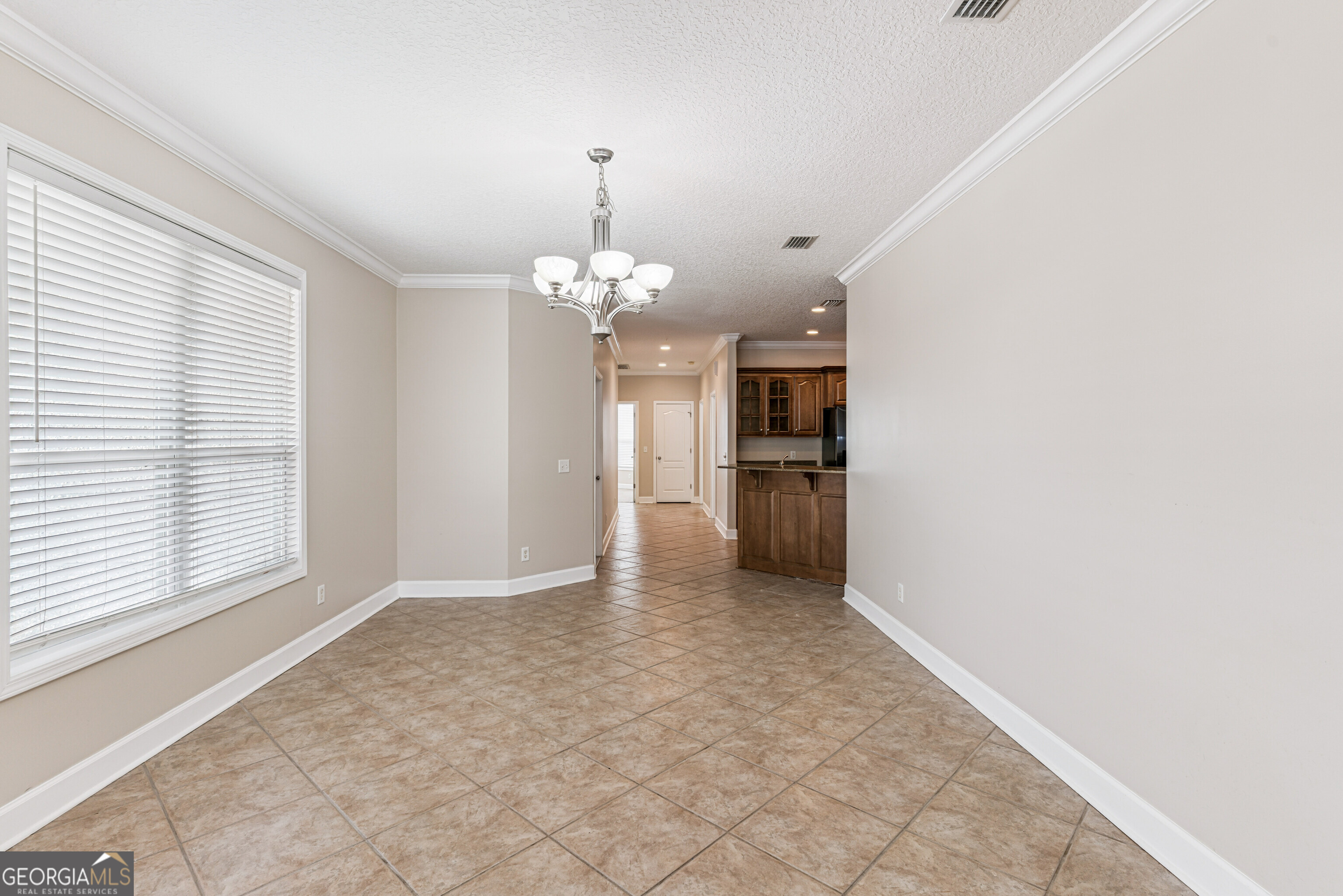 103 Meridian Drive Kingsland, GA 31548 - Photo 11 of 28 wooden floor in an empty room with a window