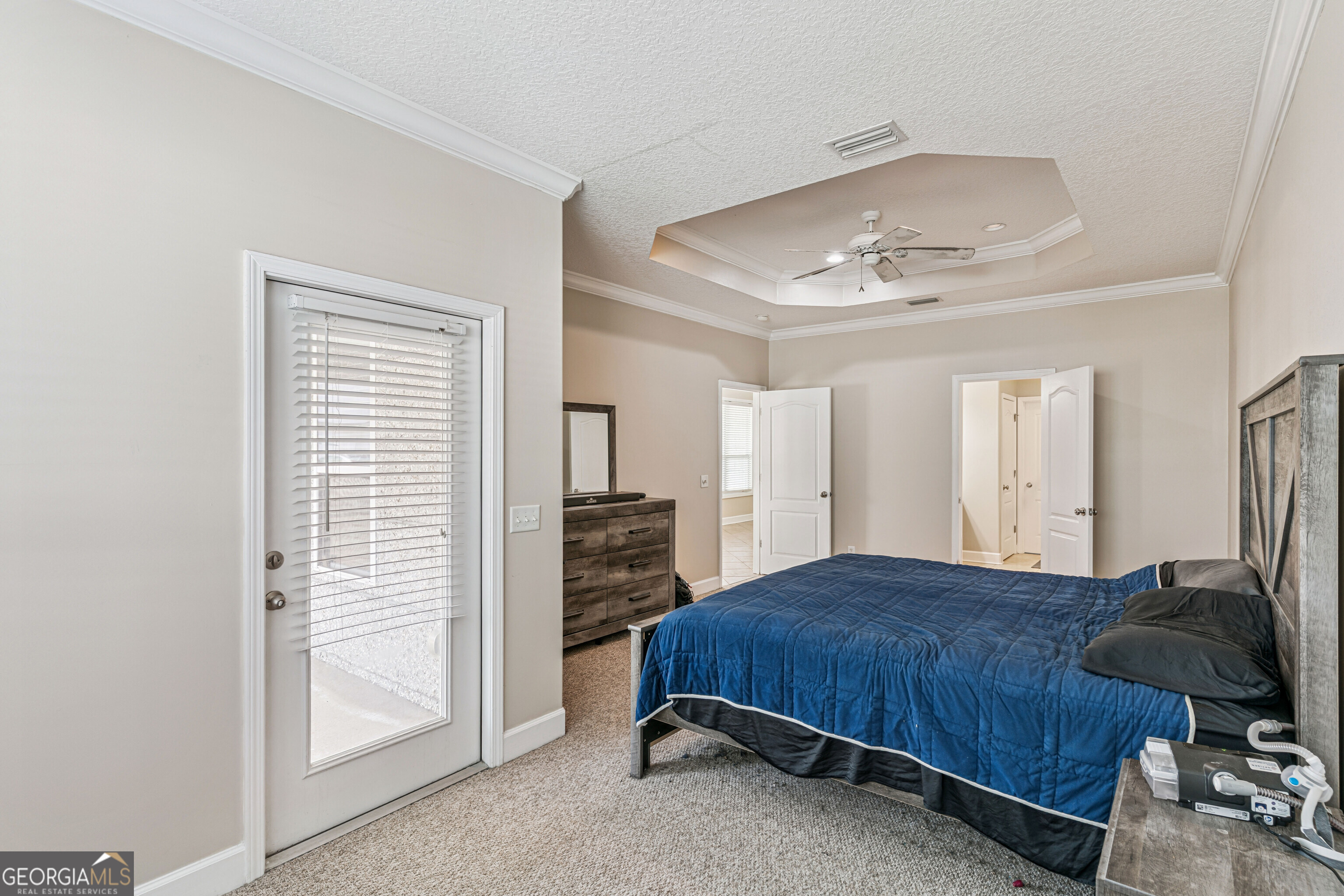 103 Meridian Drive Kingsland, GA 31548 - Photo 14 of 28 a bedroom with a bed and dresser with mirror
