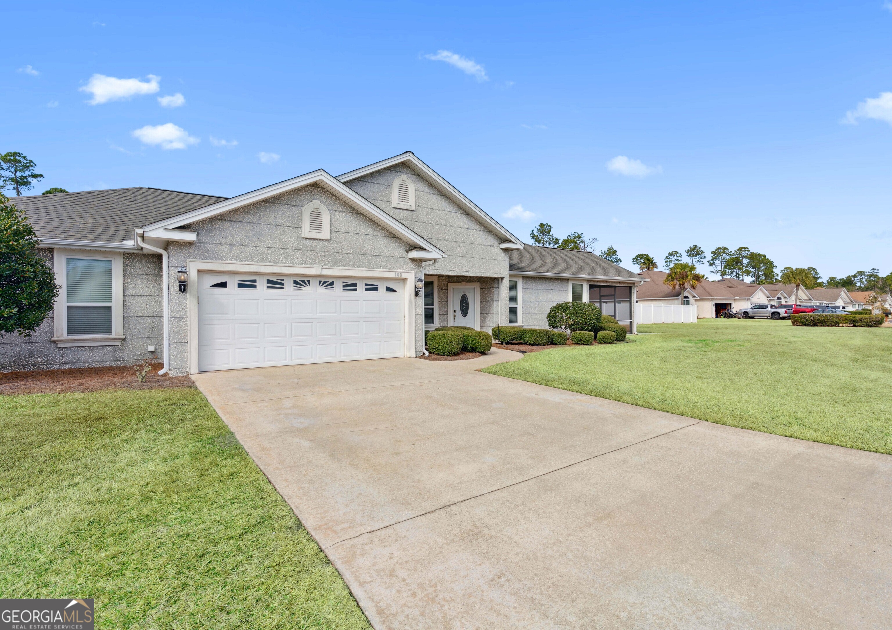 103 Meridian Drive Kingsland, GA 31548 - Photo 2 of 28 a front view of a house with a yard and garage