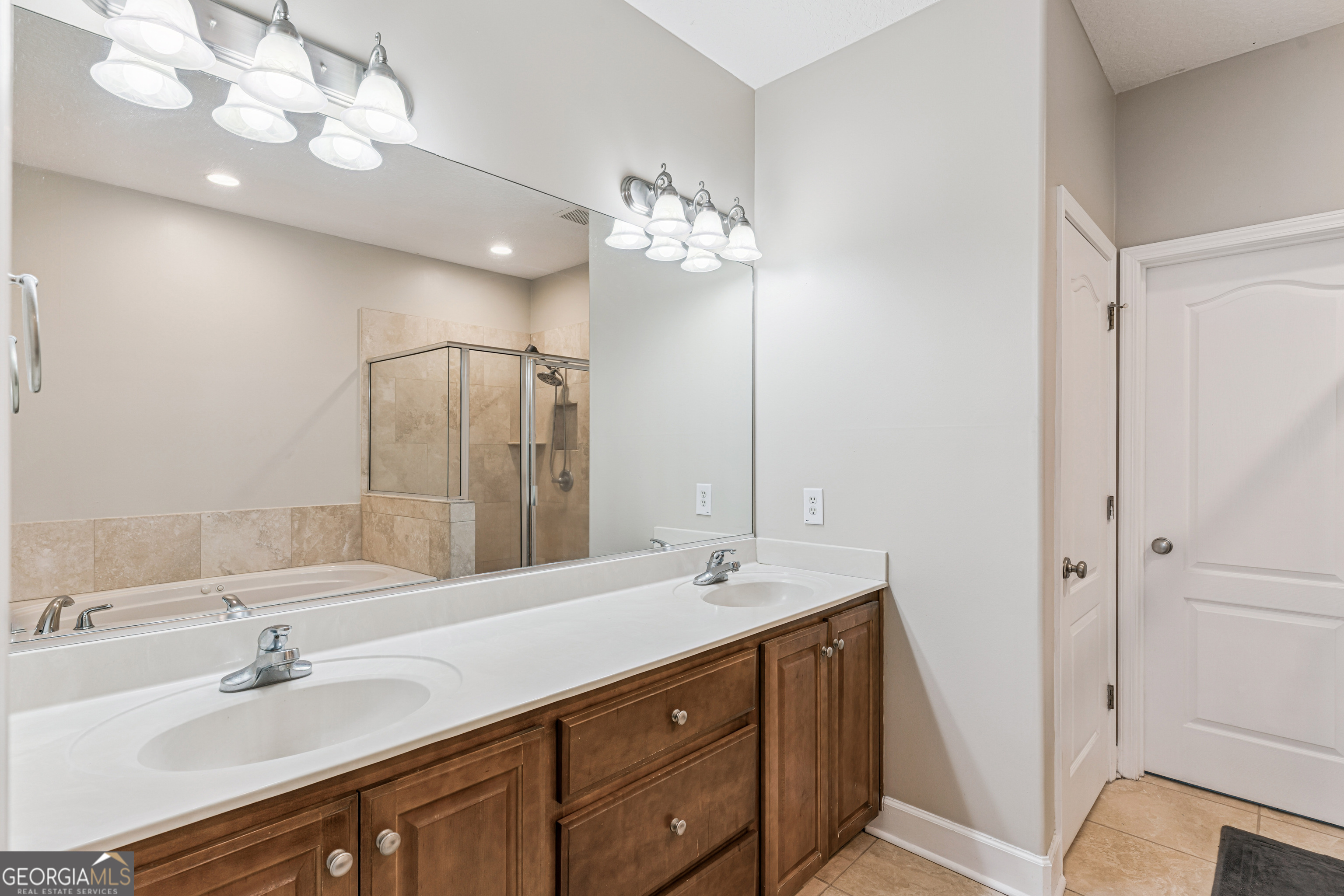 103 Meridian Drive Kingsland, GA 31548 - Photo 21 of 28 a bathroom with a double vanity sink and a mirror