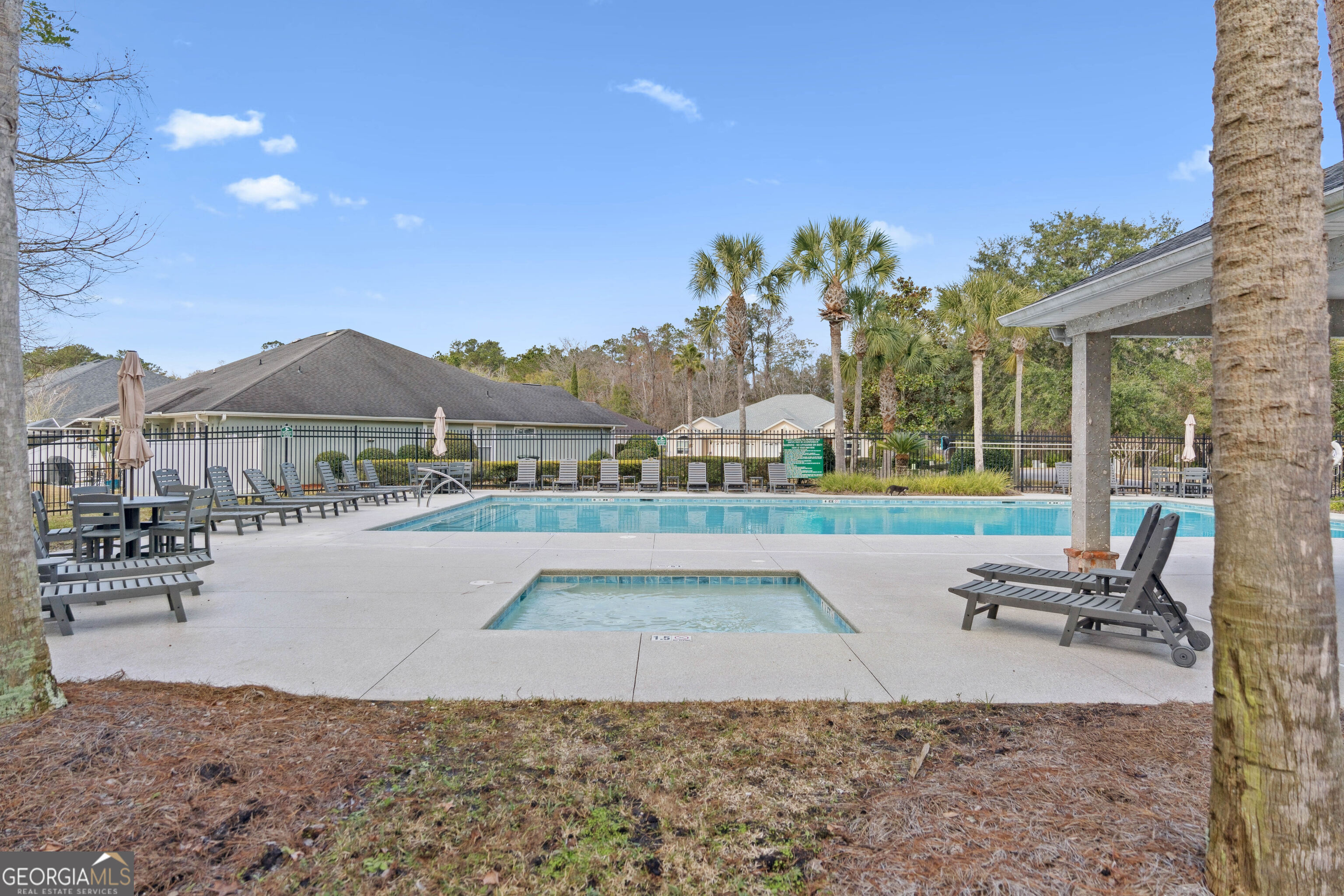 103 Meridian Drive Kingsland, GA 31548 - Photo 26 of 28 a view of a house with a swimming pool and a yard