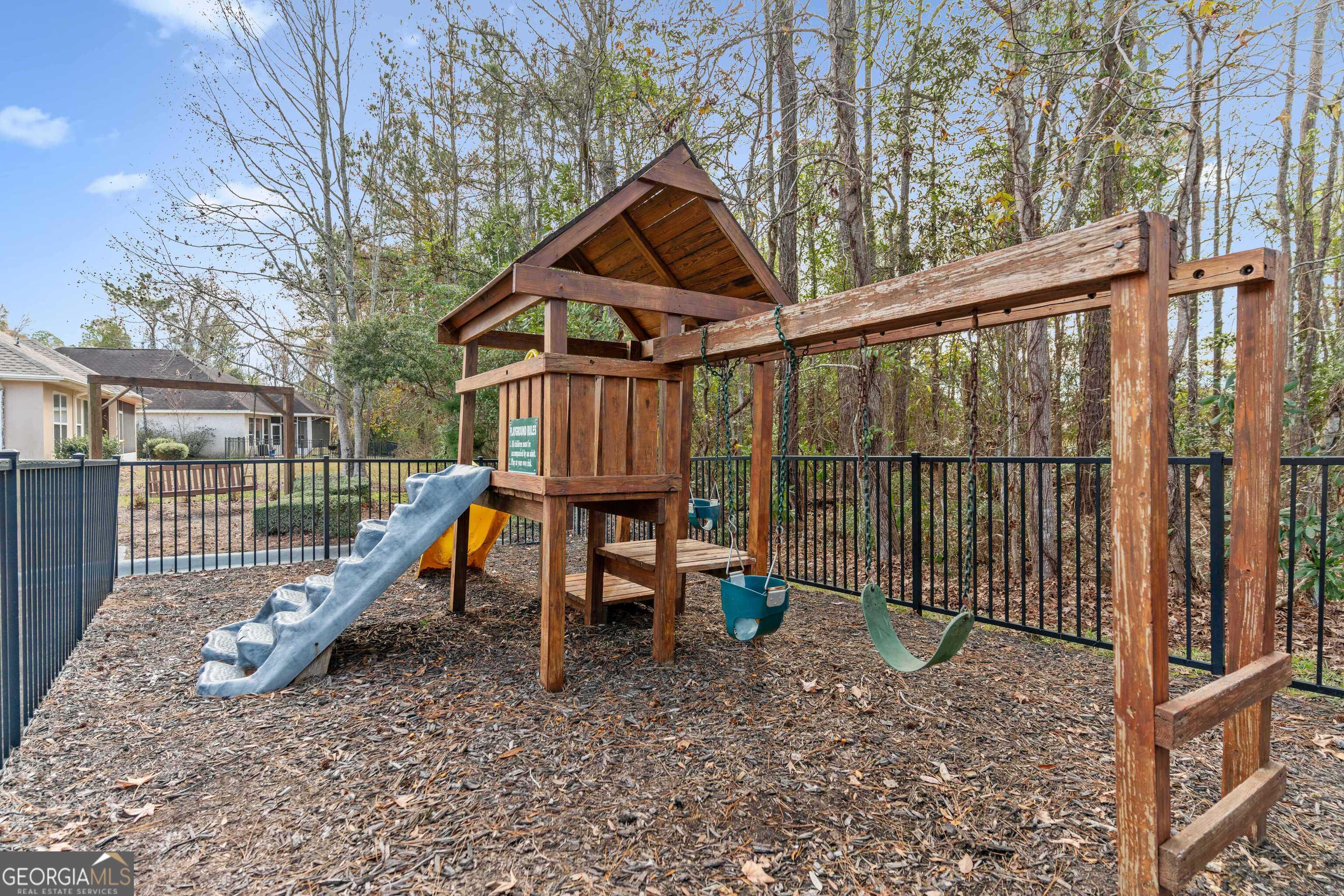 103 Meridian Drive Kingsland, GA 31548 - Photo 27 of 28 a view of wooden deck with chairs and wooden fence