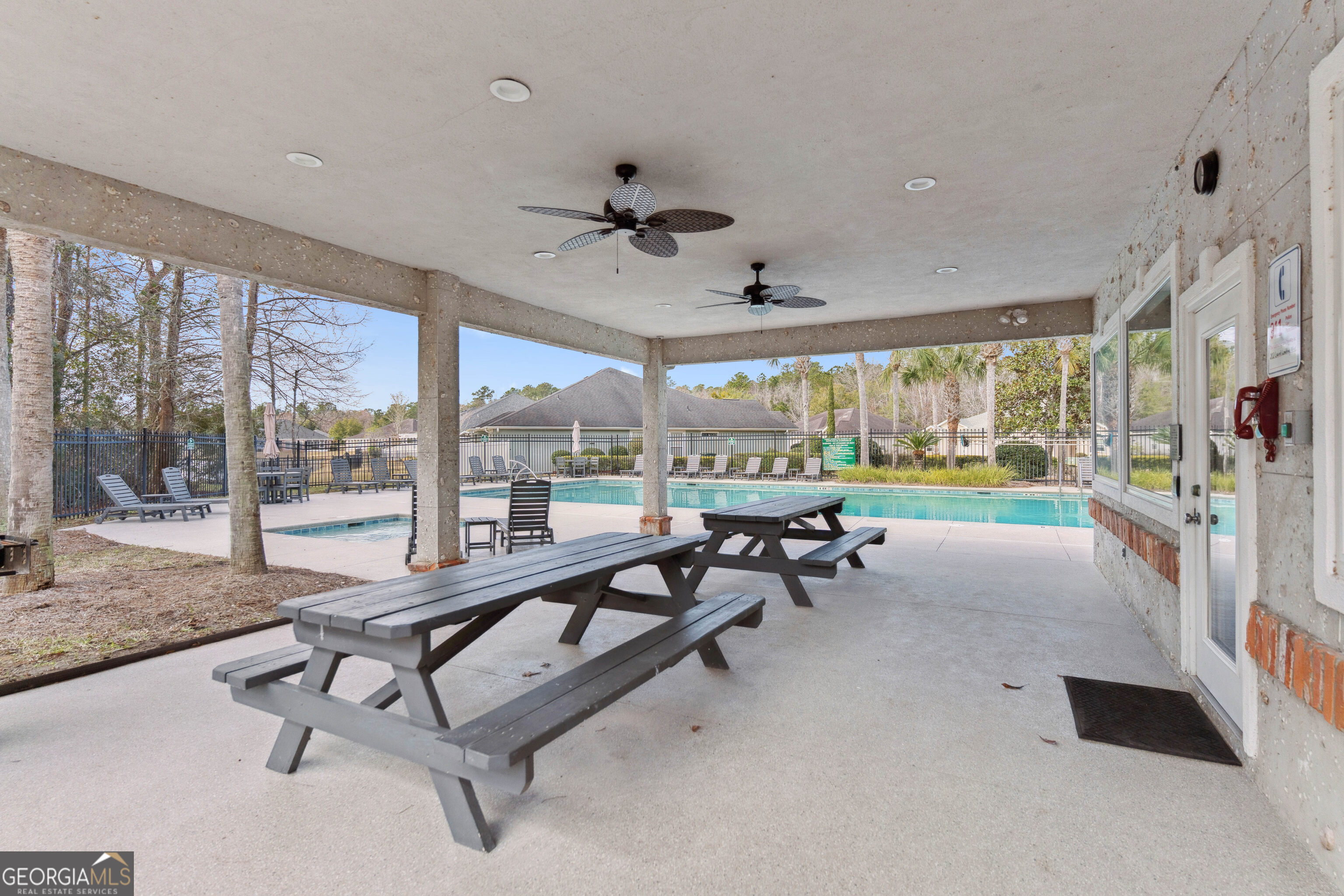 103 Meridian Drive Kingsland, GA 31548 - Photo 28 of 28 a living room with patio furniture and a large window