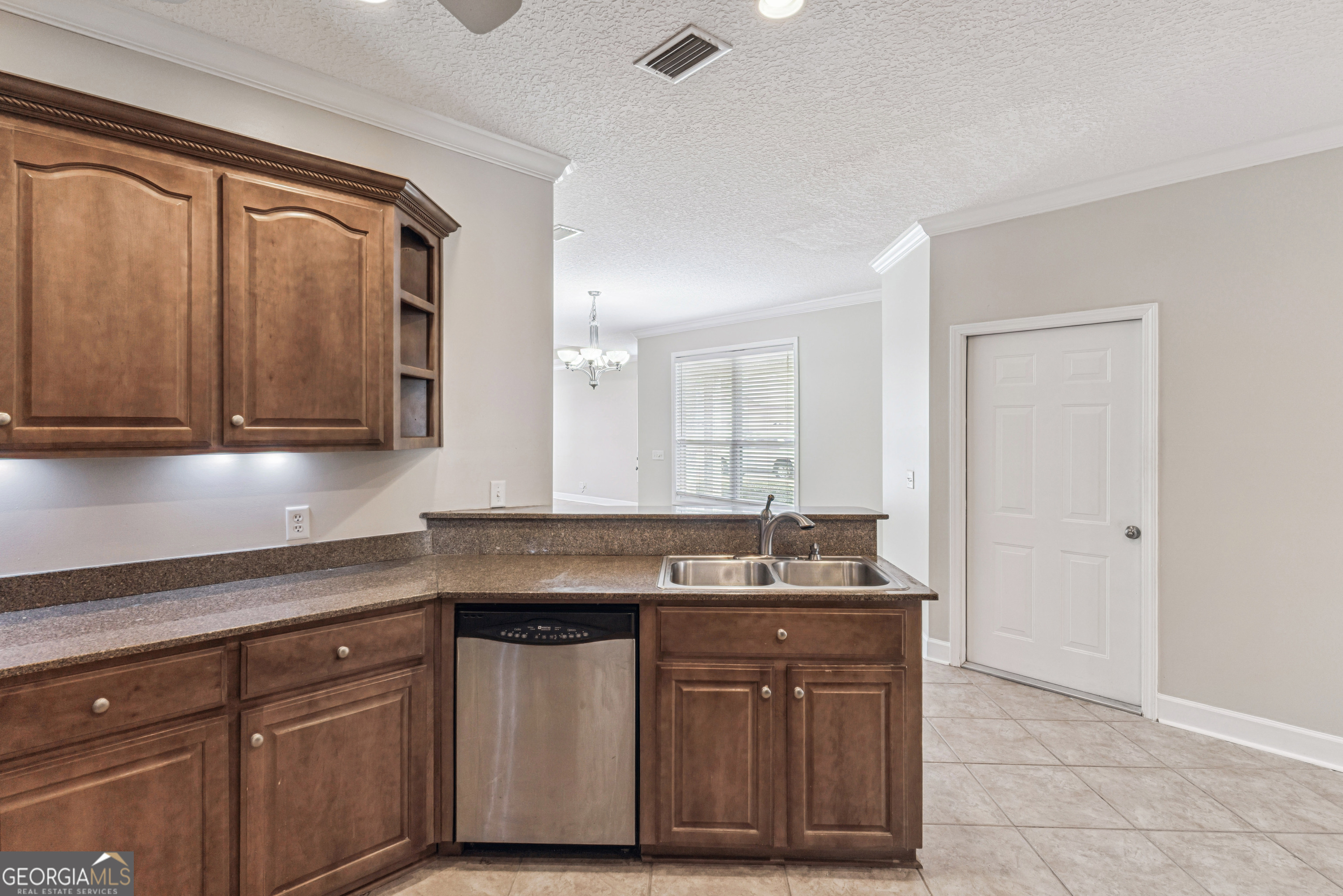 103 Meridian Drive Kingsland, GA 31548 - Photo 10 of 28 a sink with granite countertop a sink and dishwasher