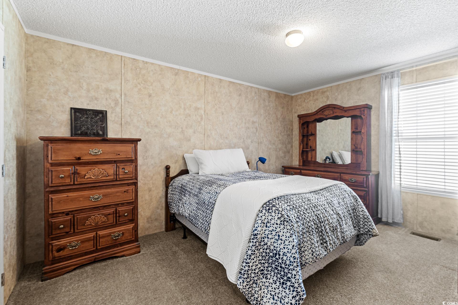 5148 Carriage Road Conway, SC 29527 - Photo 16 of 25 Carpeted bedroom featuring a textured ceiling and