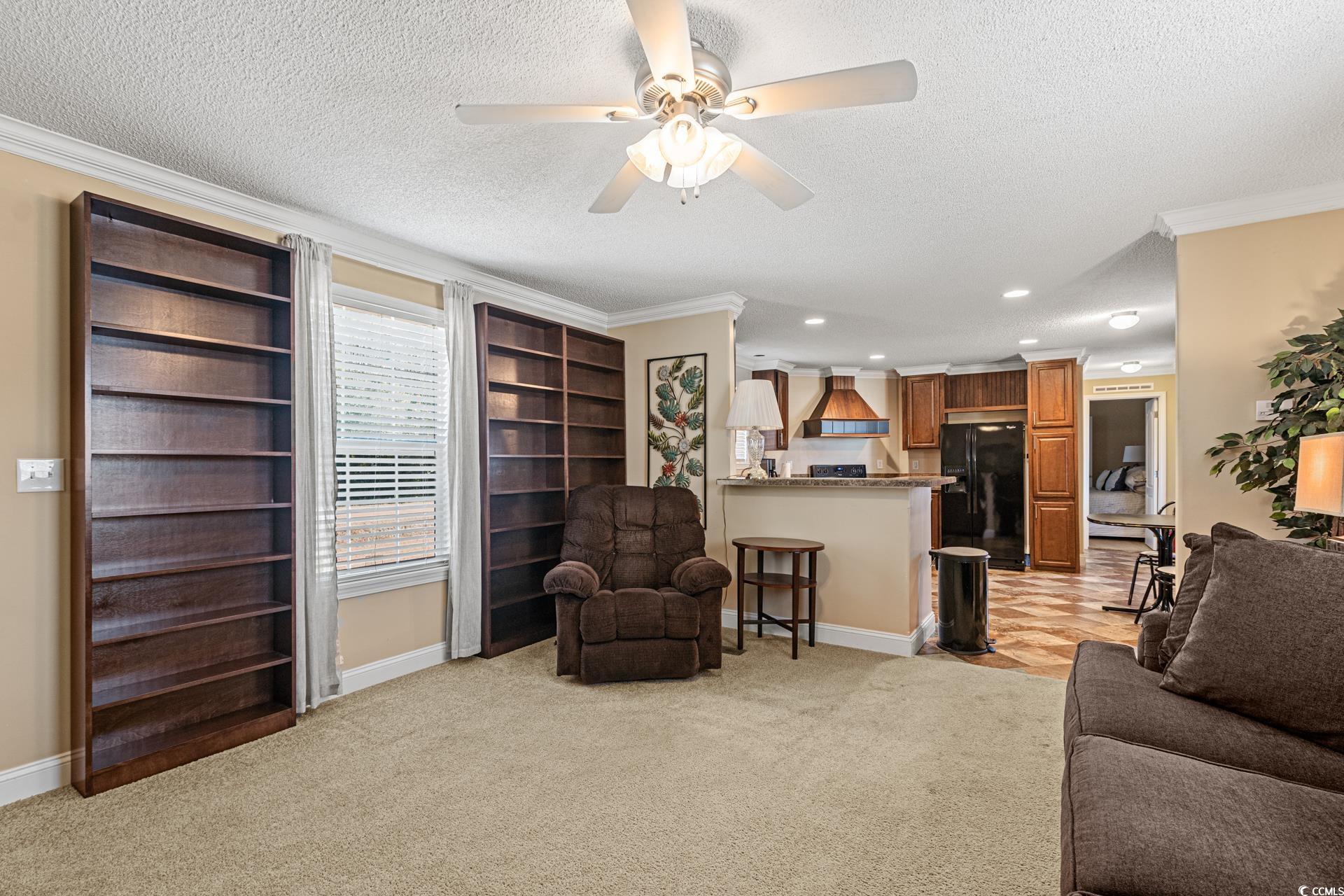5148 Carriage Road Conway, SC 29527 - Photo 5 of 25 Carpeted living room featuring a textured ceiling,