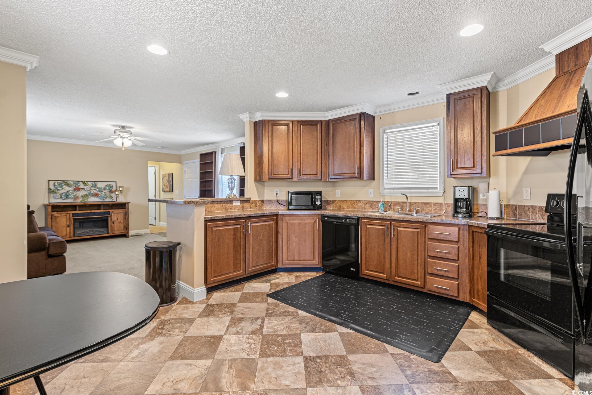 5148 Carriage Road Conway, SC 29527 - Photo 7 of 25 Kitchen with kitchen peninsula, a textured ceiling