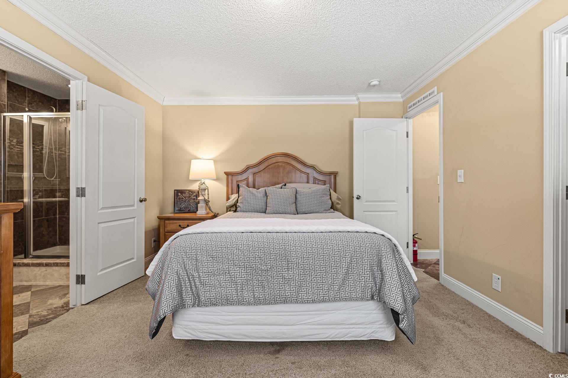 5148 Carriage Road Conway, SC 29527 - Photo 10 of 25 Bedroom featuring ensuite bath, light carpet, crow